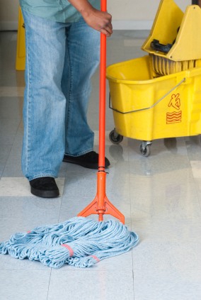 The Pro's Commercial Cleaning, LLC janitor in Peralta, NM mopping floor.